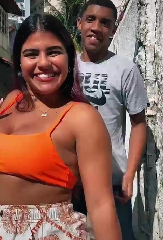 3. Seductive Julia Antunes Shows Cleavage in Orange Crop Top