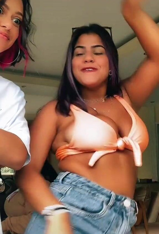 5. Attractive Julia Antunes Shows Cleavage in Peach Bikini Top