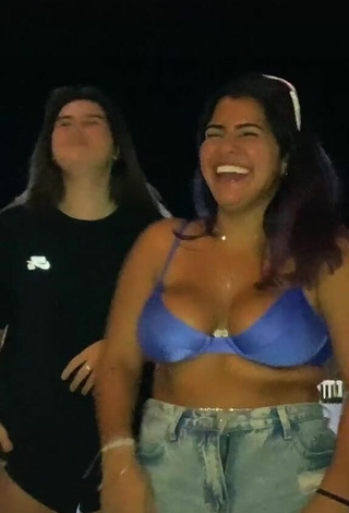 Julia Antunes Shows Cleavage in Hot Blue Bikini Top