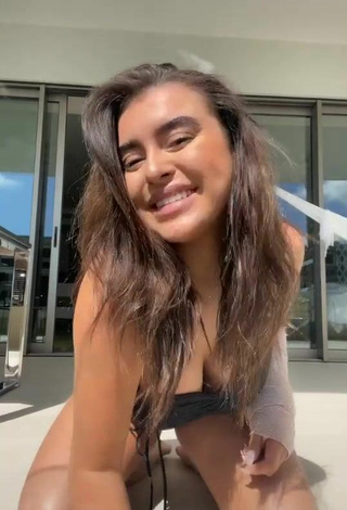 Sultry Kalani Hilliker Shows Cleavage in Black Swimsuit