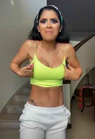 4. Dazzling Kimberly Flores Shows Cleavage in Inviting Lime Green Crop Top