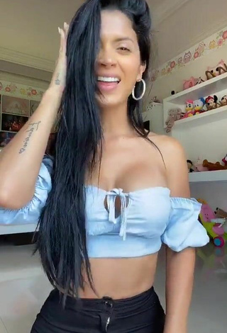 Titillating Kimberly Flores Shows Cleavage in Blue Crop Top