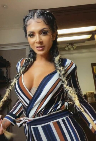 2. Sultry Kimberly Flores Shows Cleavage in Striped Overall