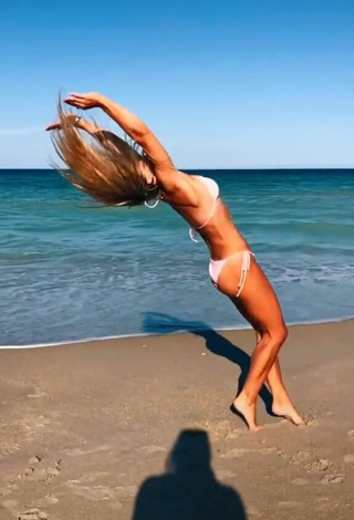 3. Seductive Olivia Dunne in White Bikini at the Beach while doing Fitness Exercises