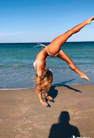 5. Seductive Olivia Dunne in White Bikini at the Beach while doing Fitness Exercises