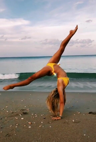 3. Wonderful Olivia Dunne in Yellow Bikini at the Beach while doing Fitness Exercises