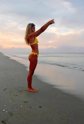 Sultry Olivia Dunne in Yellow Bikini at the Beach while doing Fitness Exercises