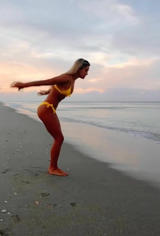 2. Sultry Olivia Dunne in Yellow Bikini at the Beach while doing Fitness Exercises