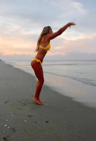 3. Sultry Olivia Dunne in Yellow Bikini at the Beach while doing Fitness Exercises