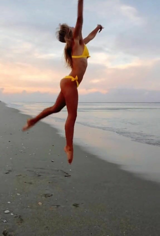 4. Sultry Olivia Dunne in Yellow Bikini at the Beach while doing Fitness Exercises