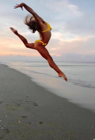 5. Sultry Olivia Dunne in Yellow Bikini at the Beach while doing Fitness Exercises