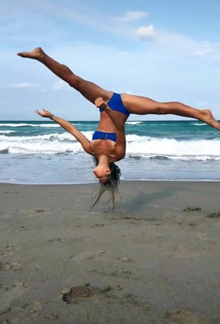 5. Beautiful Olivia Dunne in Sexy Blue Bikini at the Beach while doing Fitness Exercises