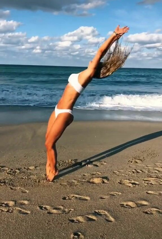 4. Really Cute Olivia Dunne in White Bikini at the Beach while doing Fitness Exercises