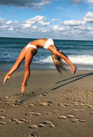 5. Really Cute Olivia Dunne in White Bikini at the Beach while doing Fitness Exercises