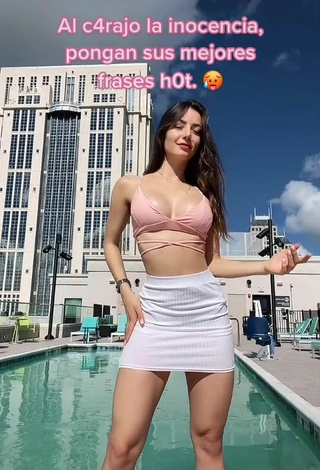 Luscious Andrea Caro Shows Cleavage in Pink Crop Top at the Pool