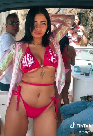 Titillating MC Lya Shows Cleavage in Red Bikini (Underboob)