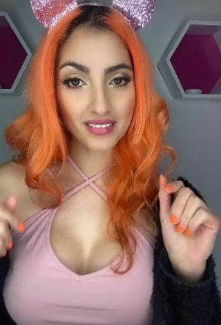 Sultry Mia Coloridas Shows Cleavage in Pink Top