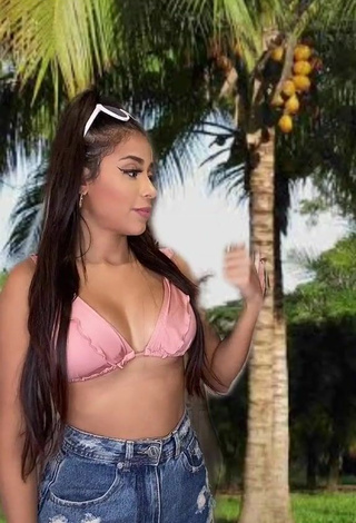 Luscious Nanda Caroll Shows Cleavage in Pink Bikini Top