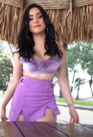 Sultry Ónice Flores Shows Cleavage in Purple Crop Top