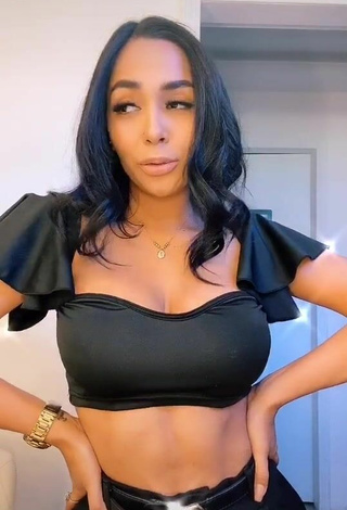 4. Hot Pao Castillo Shows Cleavage in Black Crop Top