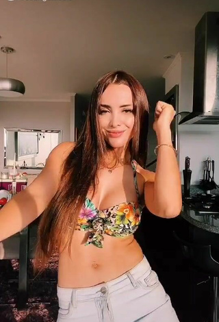 2. Erotic Rosángela Espinoza Shows Cleavage in Floral Bikini Top