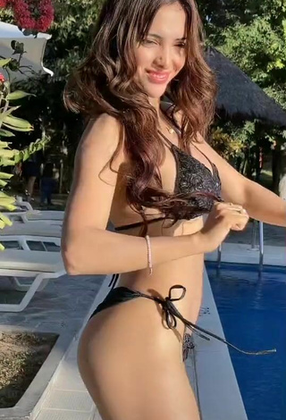 2. Elegant Rosángela Espinoza Shows Cleavage in Black Bikini at the Pool