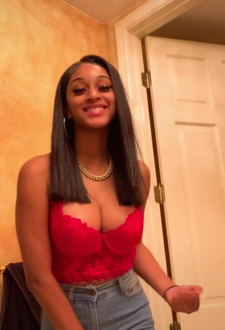 Titillating Sharan Jones Shows Cleavage in Red Crop Top