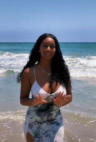 Luscious Sharan Jones at the Beach Braless and Bouncing Breasts