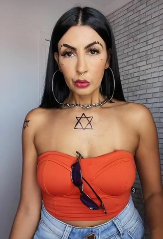 2. Sultry Sil Shows Cleavage in Electric Orange Tube Top