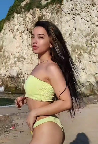 Titillating Sivara Jidkova in Yellow Bikini at the Beach