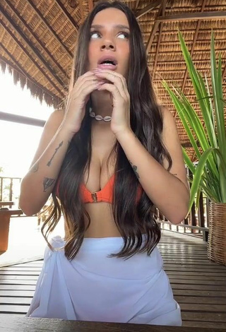 5. Sultry Stéfani Bays Shows Cleavage in Orange Bikini Top