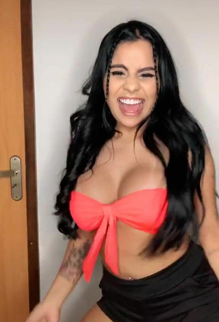 5. Luscious Tati Nunes Shows Cleavage in Orange Bikini Top