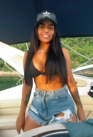 Hot Tati Nunes Shows Cleavage in Black Bikini Top on a Boat