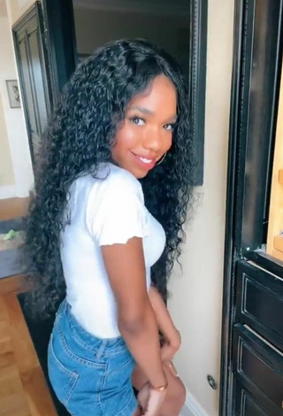 3. Sexy Teala Dunn Shows Cleavage in White Top