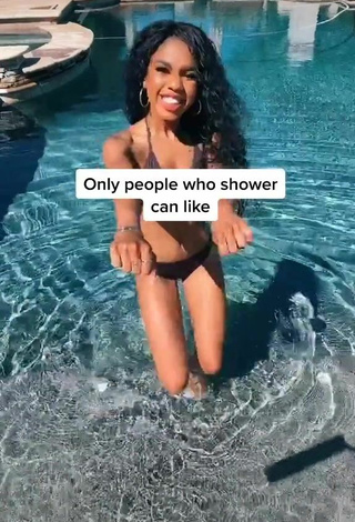 Teala Dunn in Inviting Black Bikini at the Pool