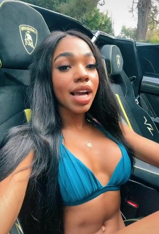 2. Luscious Teala Dunn Shows Cleavage in Blue Bikini Top in a Car