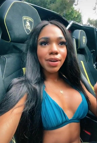 4. Luscious Teala Dunn Shows Cleavage in Blue Bikini Top in a Car