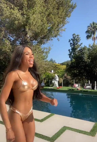 Hottest Teala Dunn Shows Cleavage in Golden Bikini at the Swimming Pool