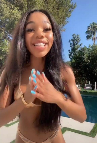 3. Hottest Teala Dunn Shows Cleavage in Golden Bikini at the Swimming Pool