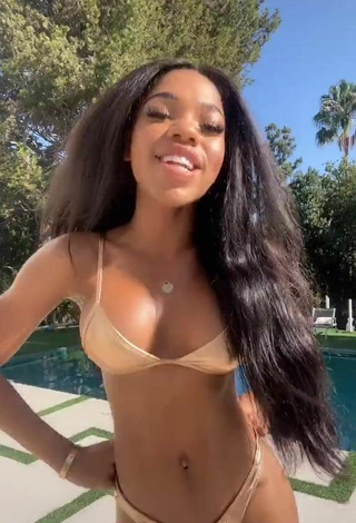 5. Hottest Teala Dunn Shows Cleavage in Golden Bikini at the Swimming Pool