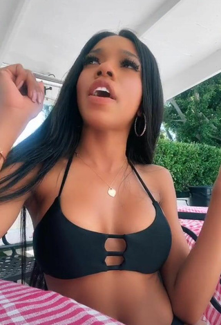 4. Sexy Teala Dunn Shows Cleavage in Black Bikini Top