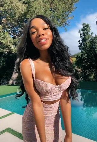 Cute Teala Dunn Shows Cleavage in Leopard Crop Top at the Pool