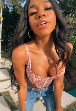 Sultry Teala Dunn Shows Cleavage in Leopard Crop Top