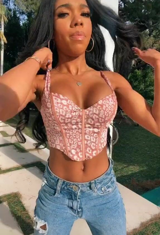 2. Sultry Teala Dunn Shows Cleavage in Leopard Crop Top