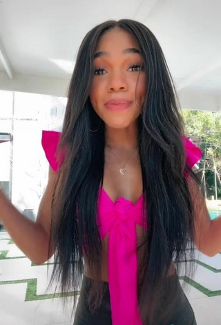 3. Titillating Teala Dunn Shows Cleavage in Firefly Rose Crop Top