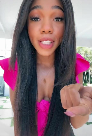 5. Titillating Teala Dunn Shows Cleavage in Firefly Rose Crop Top