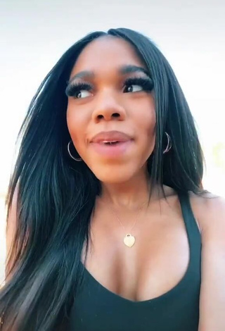 Luscious Teala Dunn Shows Cleavage in Black Top