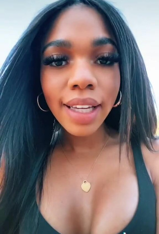 3. Luscious Teala Dunn Shows Cleavage in Black Top