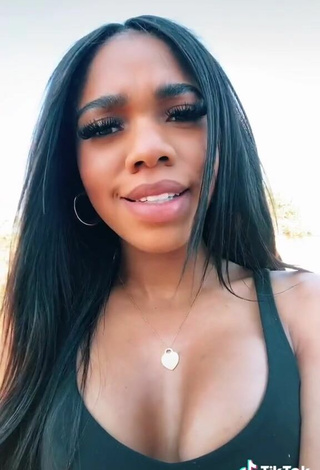 4. Luscious Teala Dunn Shows Cleavage in Black Top