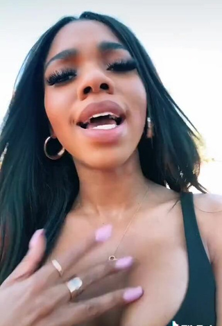 5. Luscious Teala Dunn Shows Cleavage in Black Top